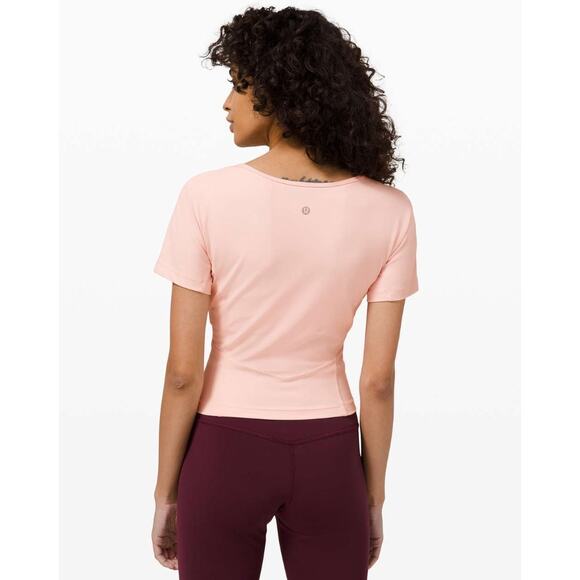 (4) $68 Lululemon Nulu Cropped Slim Yoga Short Sleeve Pink Mist - Picture 2 of 8